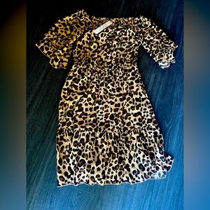 New with tags.  Off the shoulder leopard print dress.